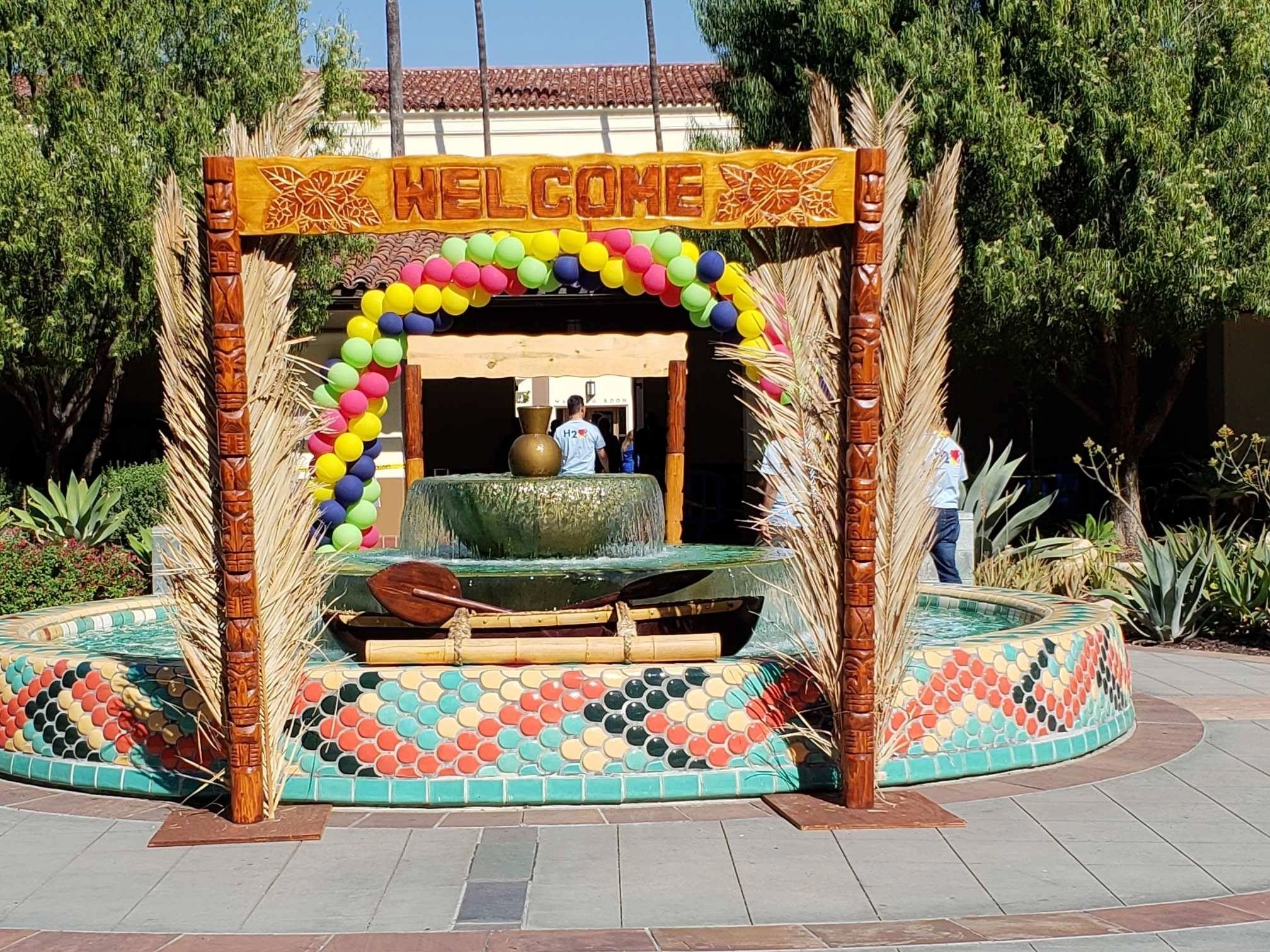 Luau props — assorted tikis, signs, and tropical decorations