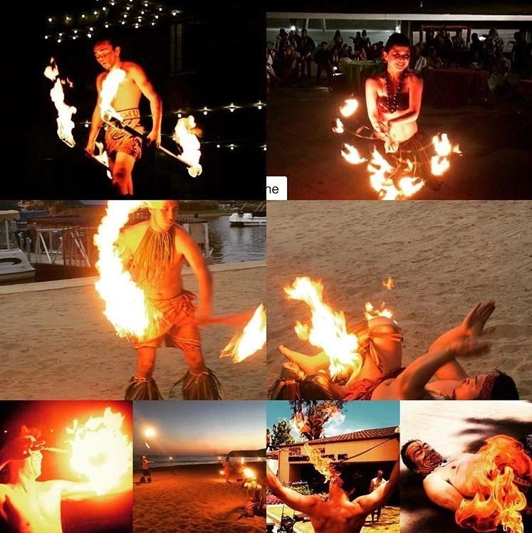 Polynesian fire dancer performing at a luau show