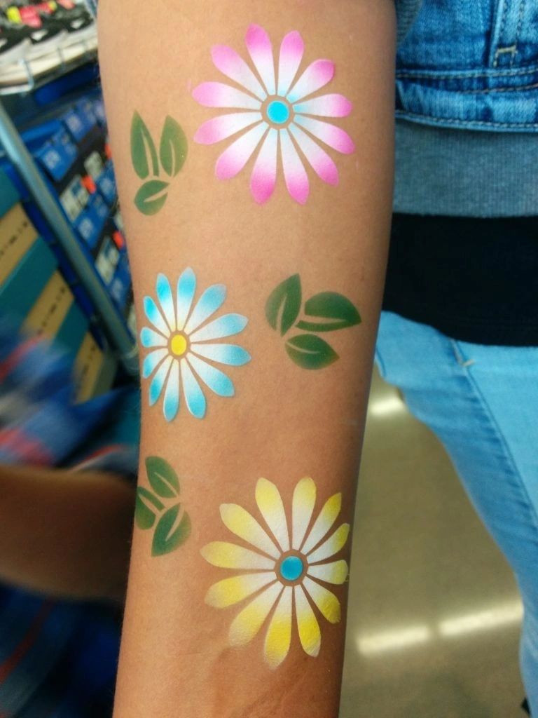 Airbrush tattoo artist at a kids party